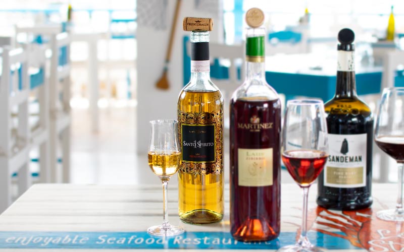 PalmBeach Tropical Restaurant | Santo Spirito 11 Vin Santo Frescobaldi <small>(al calice)</small> | Vol. 16,0% / Trebbiano Toscano, Malvasia Bianca / Italia, Toscana / Vino liquoroso piacevolmente aromatico e con intensi sentori di miele e frutta secca. Abbinamento ideale con i Cantucci Toscani.
